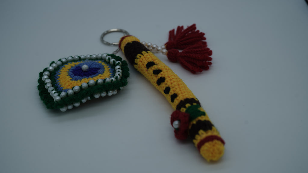 Handmade Crochet Flute and Peacock Feather Keychain Set with Pearl Embellishments