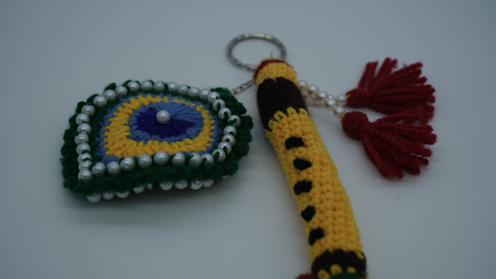 Handmade Crochet Flute and Peacock Feather Keychain Set with Pearl Embellishments
