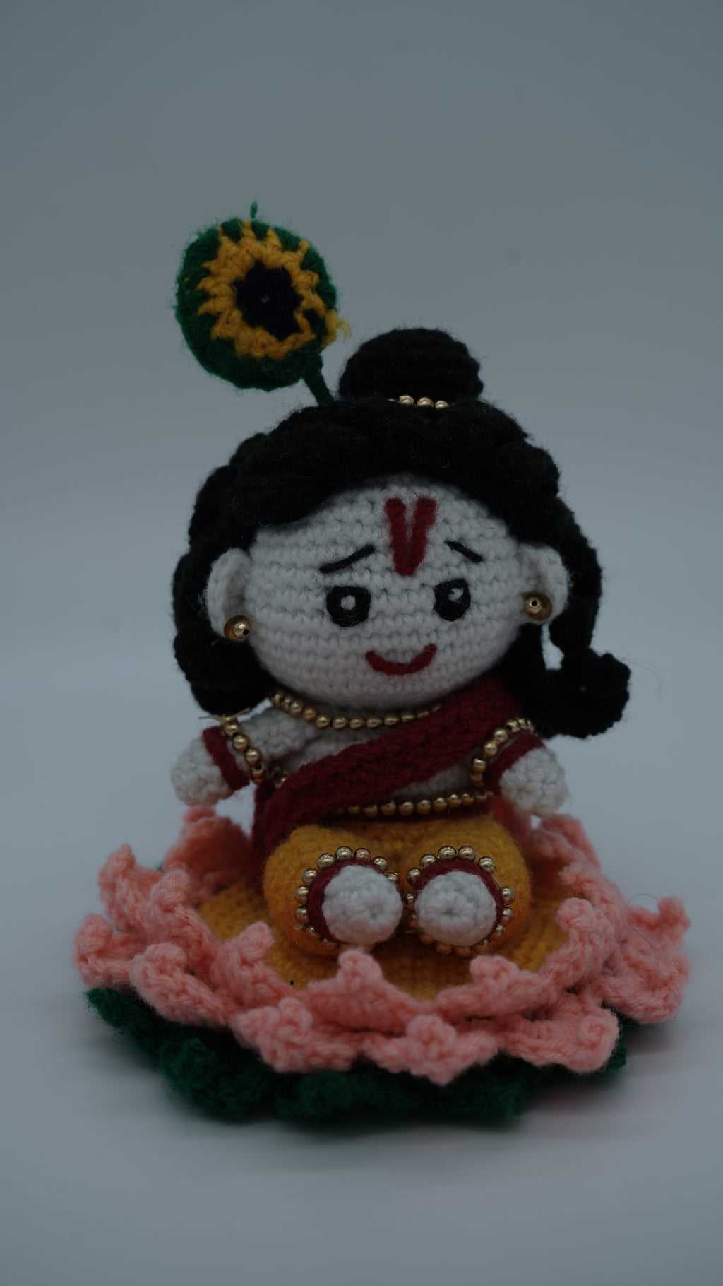 Handmade Crochet Laddu Gopal Ji Idol with Decorative Beads and Lotus Base