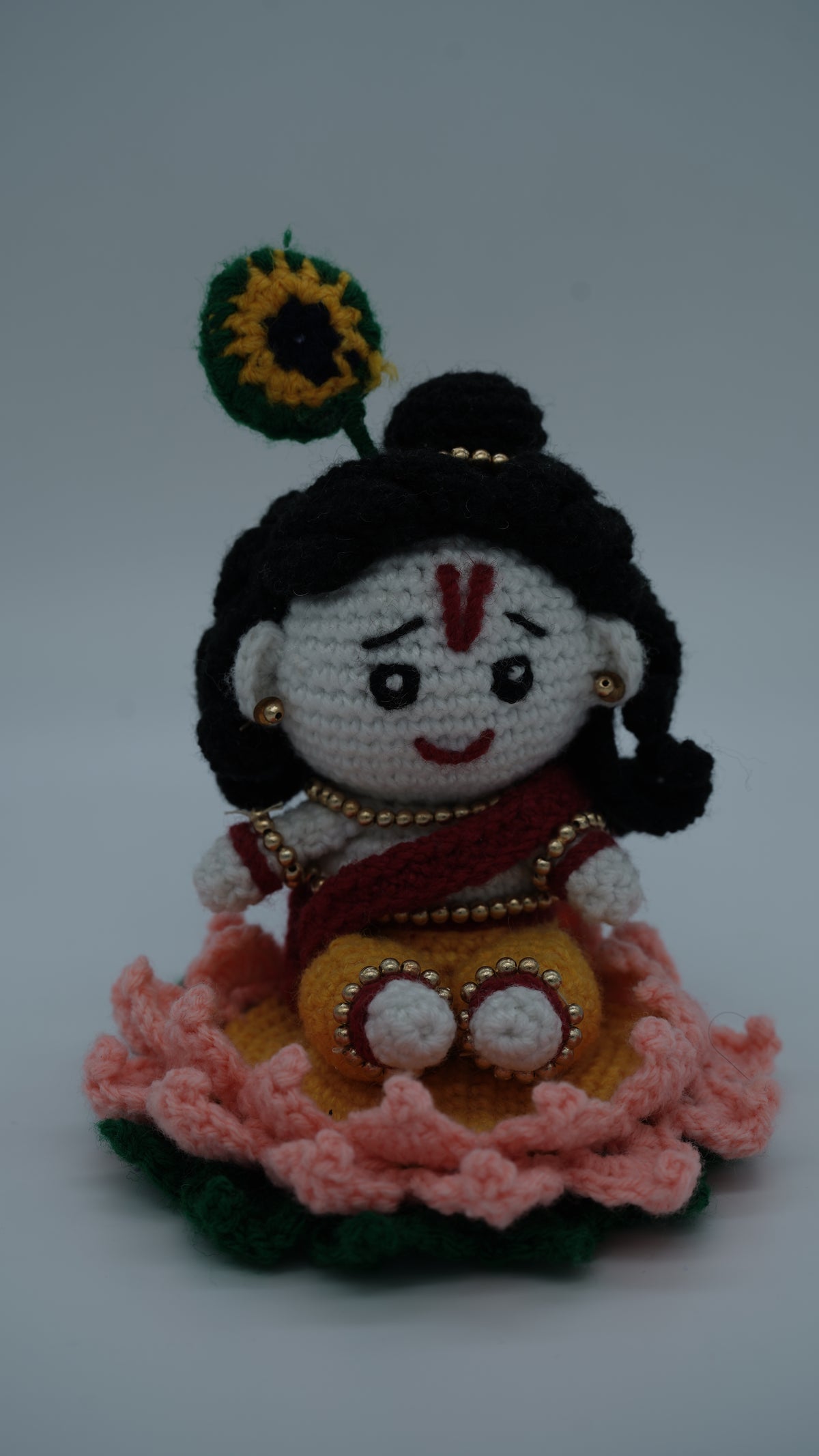 Handmade Crochet Laddu Gopal Ji Idol with Decorative Beads and Lotus Base