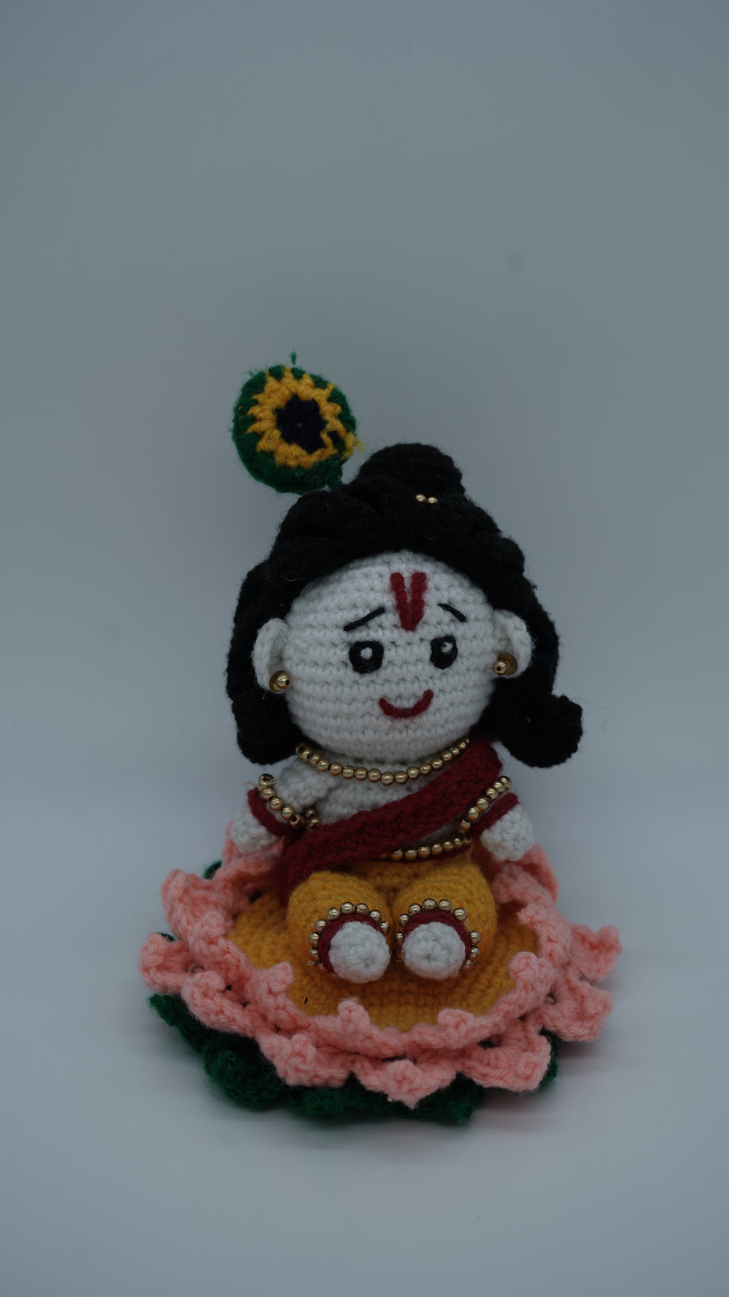 Handmade Crochet Laddu Gopal Ji Idol with Decorative Beads and Lotus Base