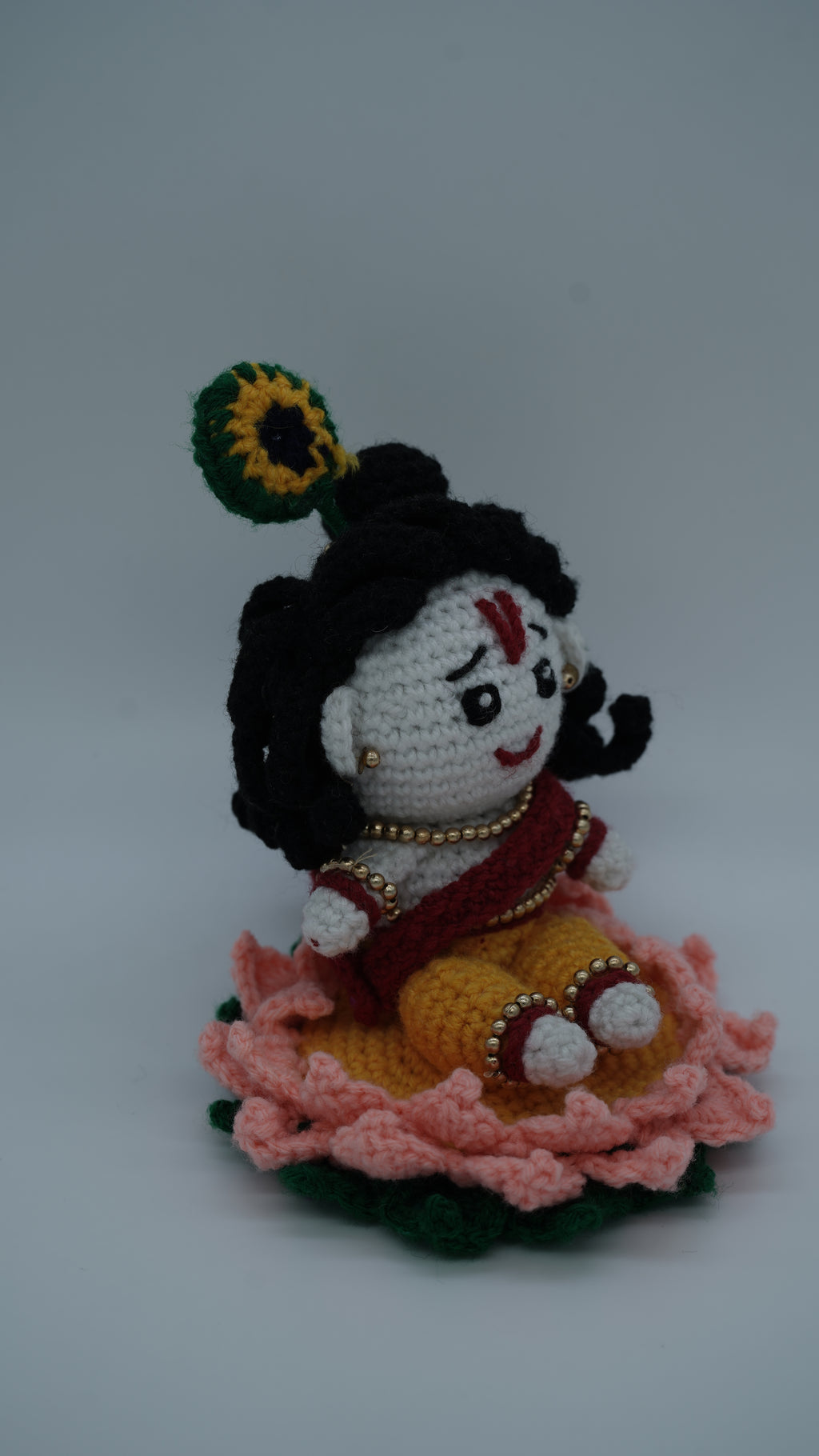 Handmade Crochet Laddu Gopal Ji Idol with Decorative Beads and Lotus Base
