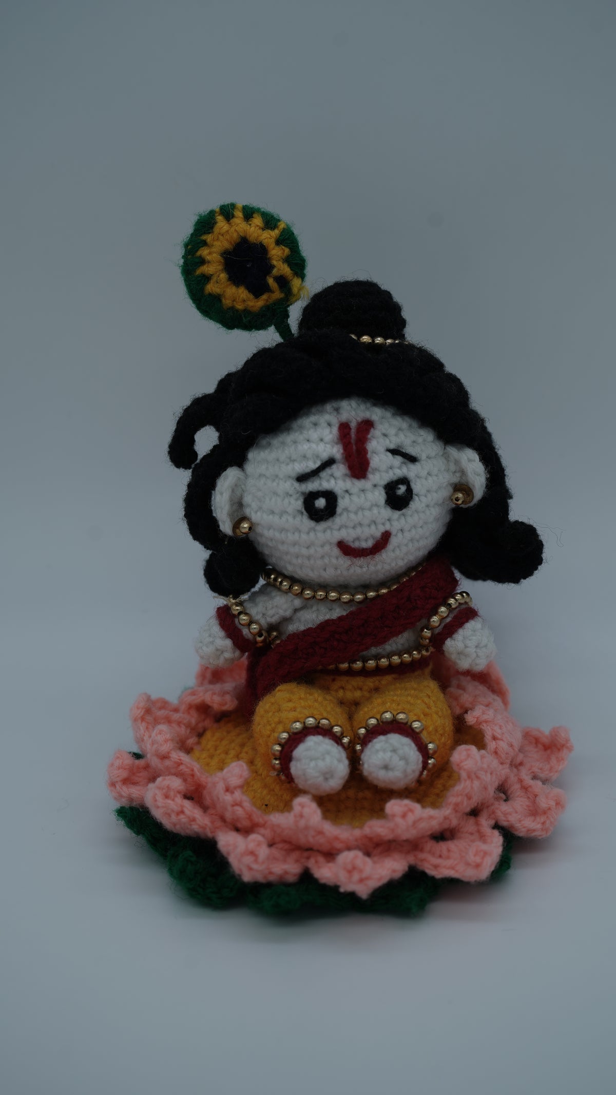 Handmade Crochet Laddu Gopal Ji Idol with Decorative Beads and Lotus Base